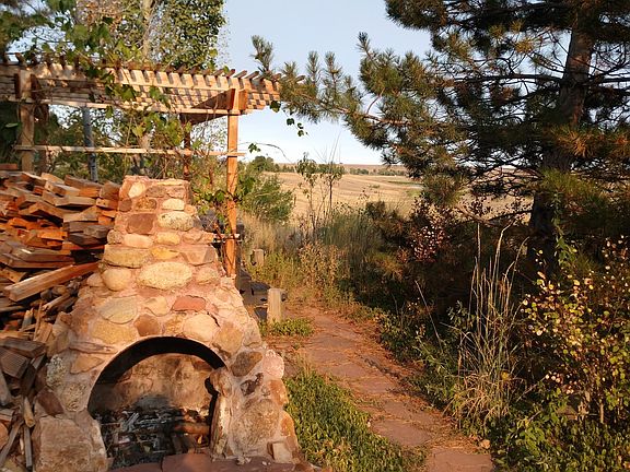 Your exterior fireplace and hot tub area.
