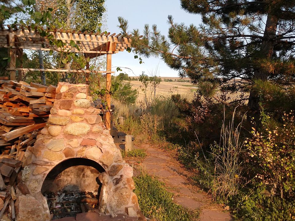 Your exterior fireplace and hot tub area.