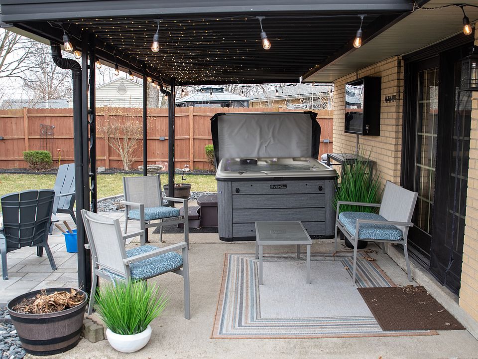 The ultimate relaxation spot! Soak your worries away in our private hot tub, nestled under a cozy covered patio with magical string lights.