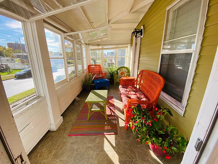 The south-facing sunporch has abundant space for sun-loving plants!