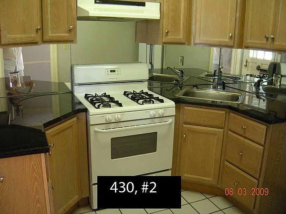 Granite counter tops, mirrored backsplash. Lovey kitchen. The downside - no dishwasher; no place to squeeze one in. To the left 