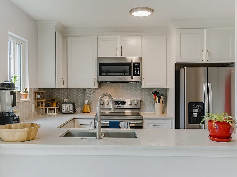 Enjoy cooking in this functional kitchen_complete with modern appliances, ample counter space, and everything you need to feel right at home.