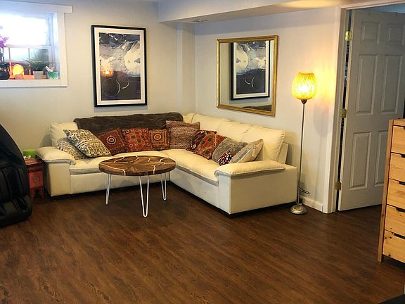 Another view of downstairs den with lower level bedroom and half bath off to the right