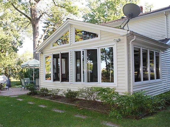 Current owners have extended the family room to create a huge gathering space and take advantage of the lovely back yard views.  High quality windows throughout this home.
