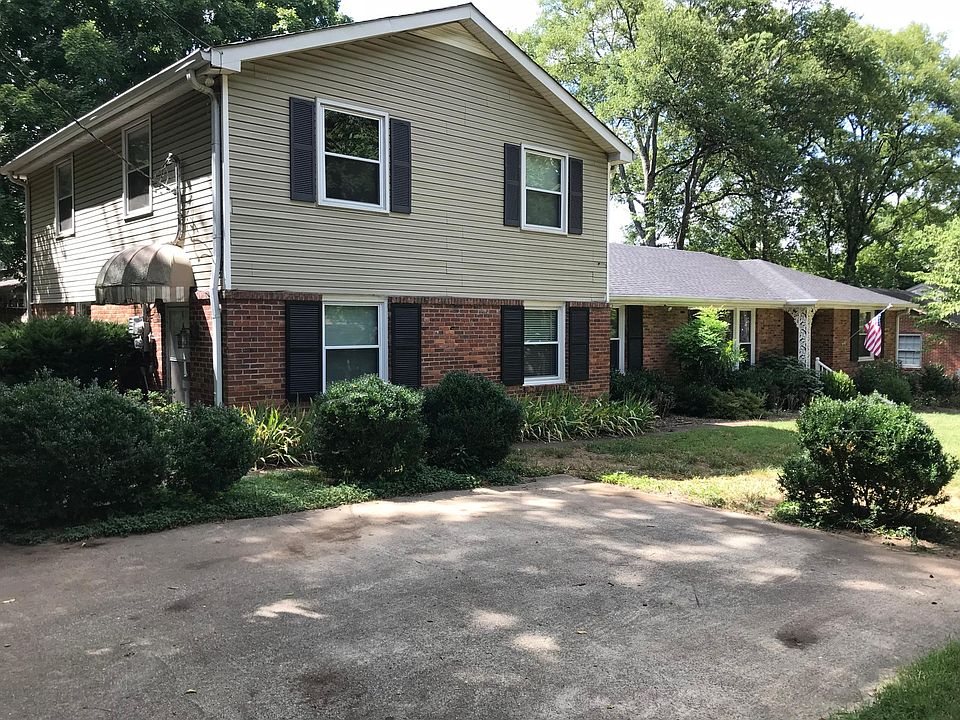 Front of home. Apartment is the upstairs portion. Also, the parking for the apartment.