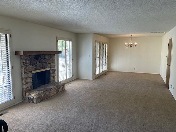 Living room and dining room combo with new carpet and paint