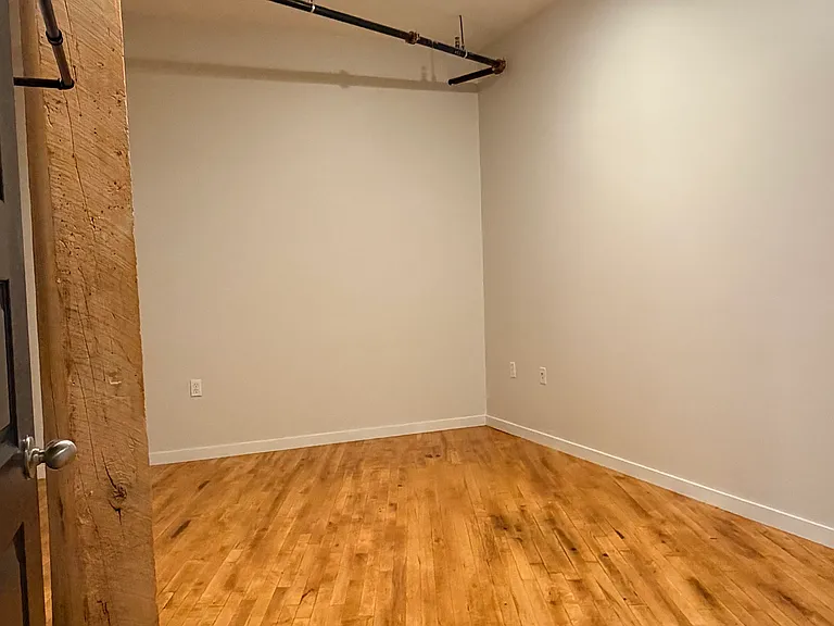 Bedroom 2 (Photos of similar unit with same floor plan. Unit 211 will have higher exposed beam ceilings. Colors, finishes, and fixtures may vary)