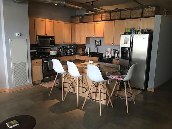 Spacious kitchen with huge island, tons of storage, granite counters and stainless appliances (yes, there is also a garbage disposal)