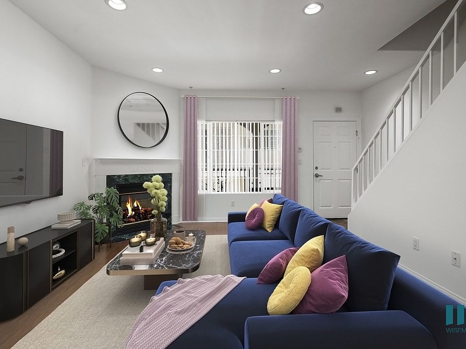 Living Room with Fireplace, Recessed Lighting, and Vinyl Flooring