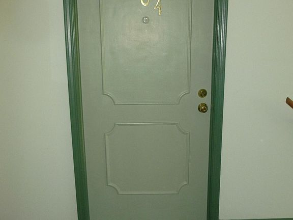 Door leading to inside of unit from hall. Need key to get in