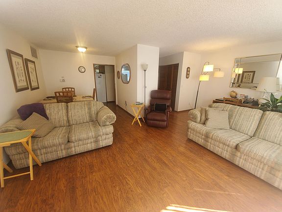 Open floor plan living and dining room off kitchen