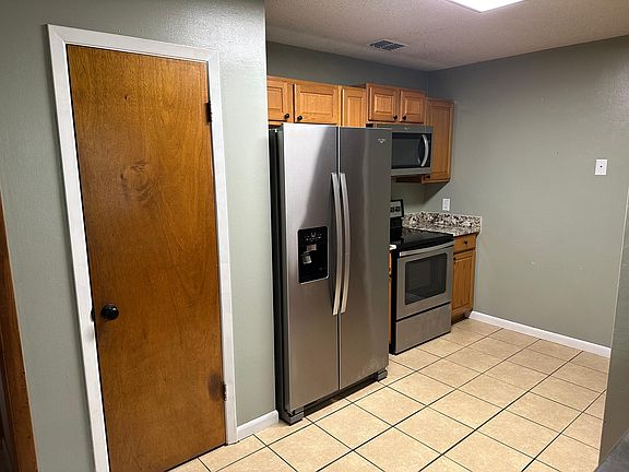 Kitchen with full sized pantry