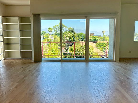 Living room with balcony facing east