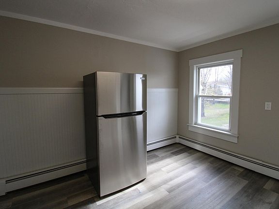 Kitchen with new stainless-steel appliances, new countertops, new floor, and new cabinets! Lots of natural light.