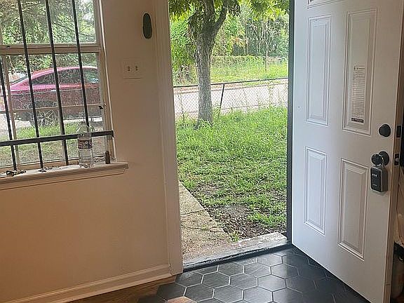 The modern look of hexagon flooring starts in the living room and is carried throughout the home.