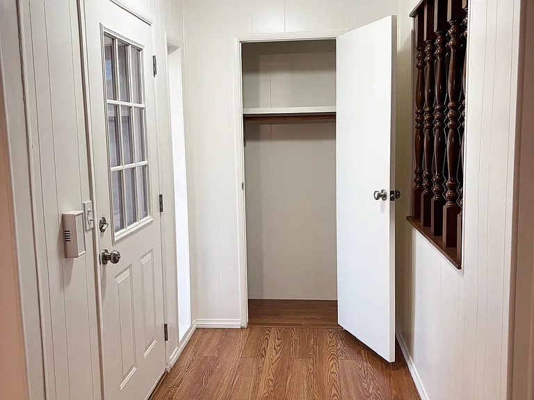 Entryway from front door with coat closet