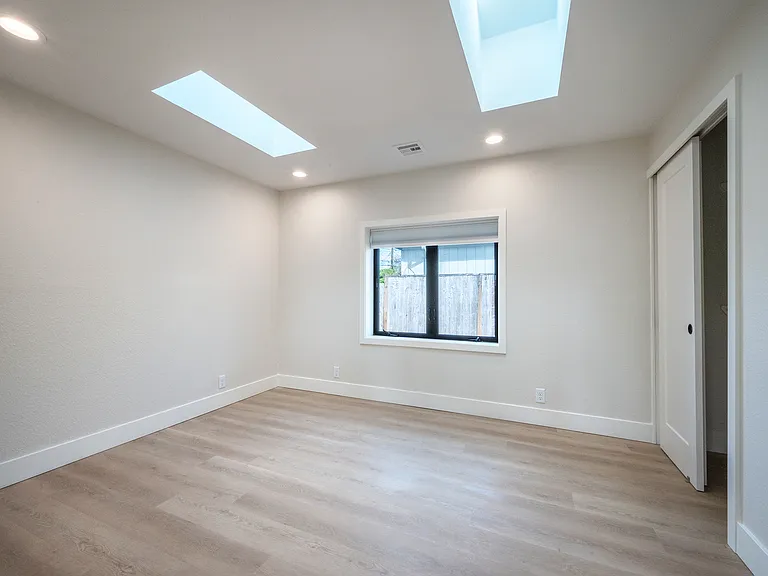 Bedroom #2 , closet organizers w/ 2 skylights and large window.