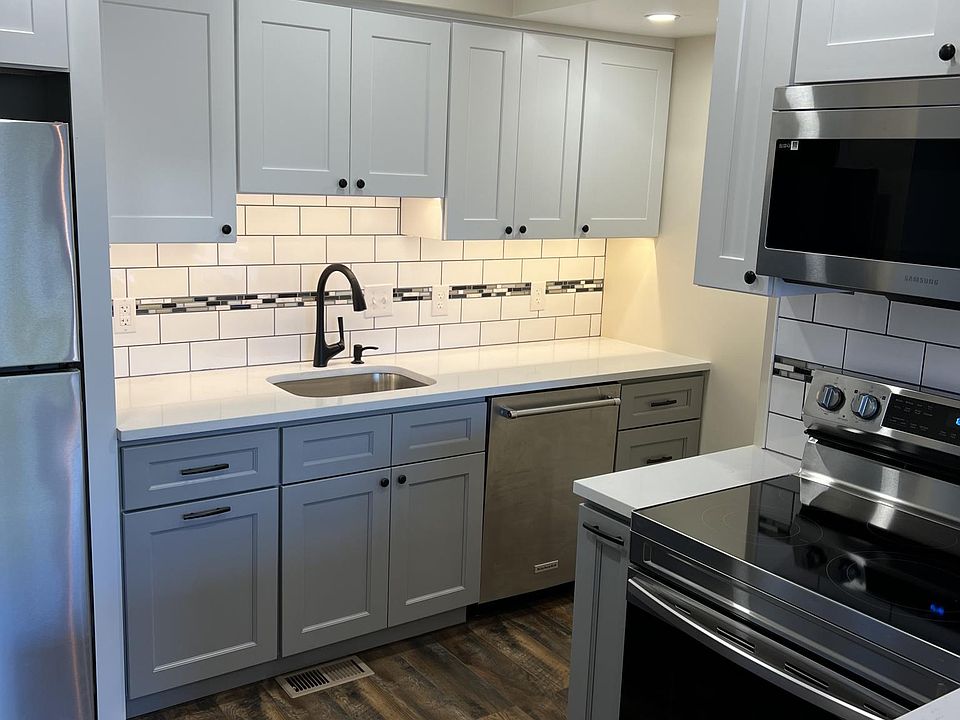 New tile backsplash with under cabinet lighting.