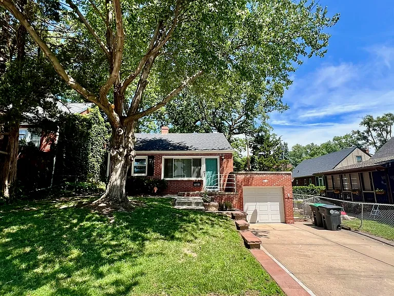 Gorgeous tree in front yard provides plenty of shade.