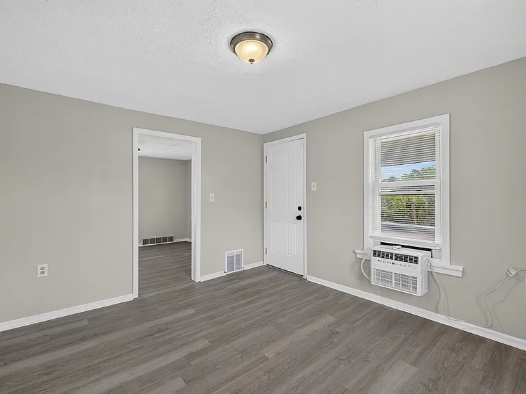 Upstairs door facing balcony. Brand New Window Unit AC