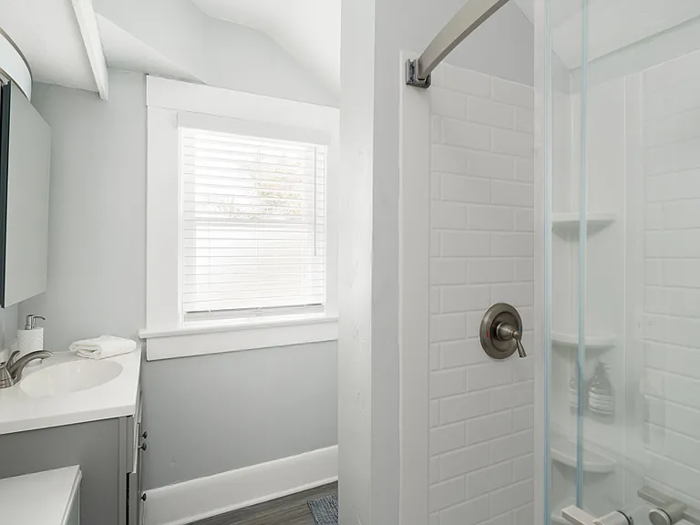 Full bathroom with shower and bathtub.