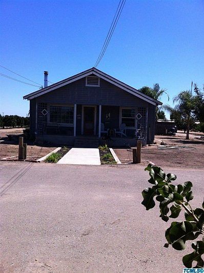 VIEW OF THE FRONT OF THE HOME FROM CLAYTON AVE. HAS LARGE FINISHED CIRCULAR DRIVE THRU IN FRONT OF HOME.