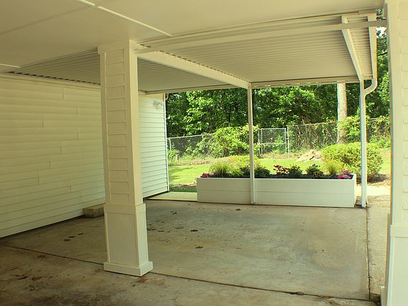 Three-car carport