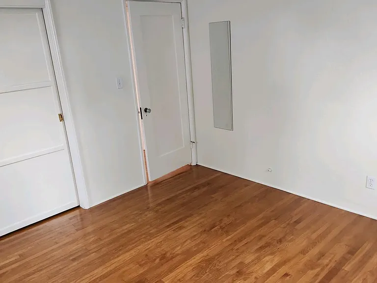 large bedroom with lots of light, new paint
