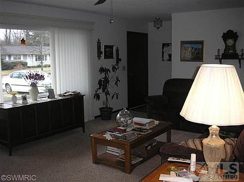 Living room with new front window that opens on both ends.