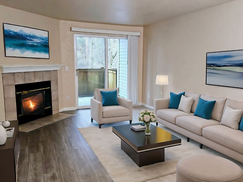 Living room with cozy wood-burning fireplace and sliding door to spacious patio.