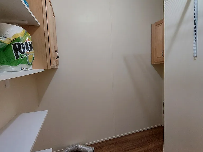 Built-in Washer and Dryer spaces are in the pantry, to keep the noise down in the rest of the house. Pantry is hidden off the Dining Room by a fake cabinet door!