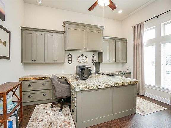 Wow! Look at this custom study with granite desk for 2 people. Built in File cabinet drawers, cabinets