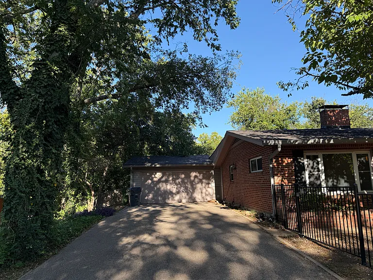 Two car garage with wide driveway