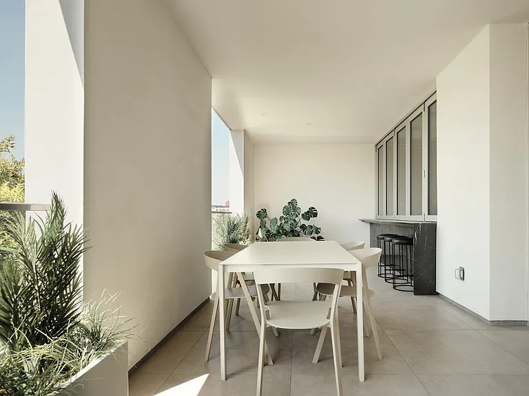 Expansive Covered Terrace with Integrated Bar _ This thoughtfully designed outdoor space offers a seamless blend of privacy and openness, featuring high ceilings, architectural framing, and a built-in bar for effortless entertaining.