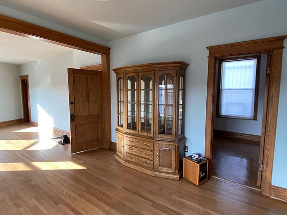 Dining Room (12'2"x12'6") looking North East. Front entrance, Hutch with built-in lighting, Bedroom 2 entrance