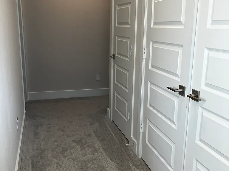 3rd floor hallway with laundry space and storage closet