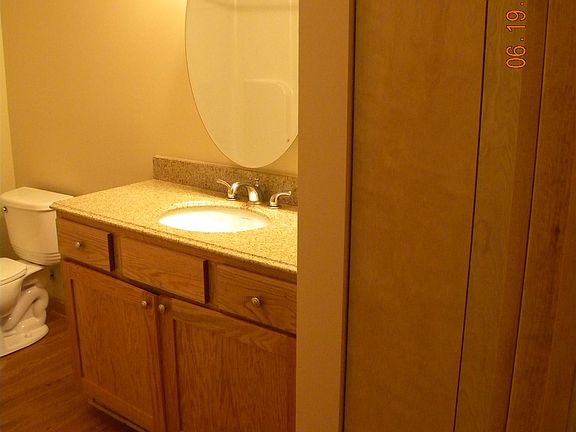 bathroom with closet for towels and extra storage