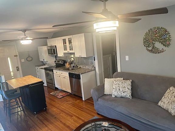 Spacious living room area. Ceiling fans match in all rooms.