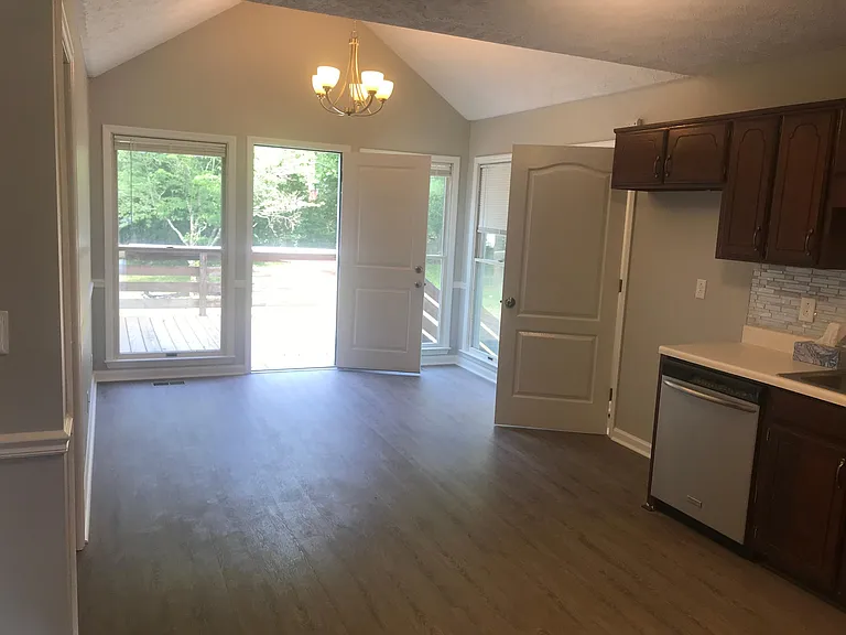 Kitchen & Eating Area. Door on left goes to the master bedroom. Door on the right takes you to the laundry room and garage
