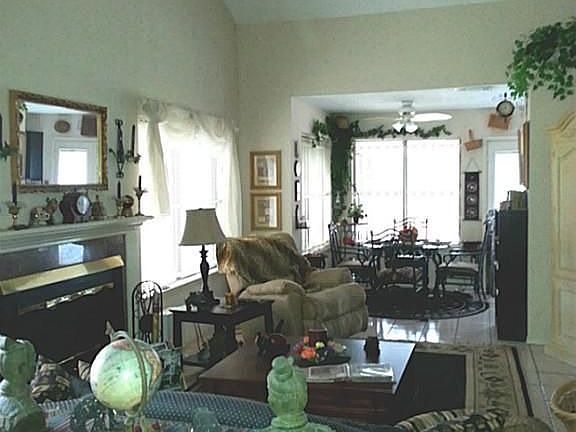 Photo of Den when furnished looking towards dining