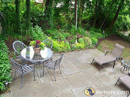 Restful backyard patio/garden area. 
