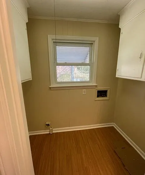 Laundry room with washer and dryer hookups and plenty of storage.