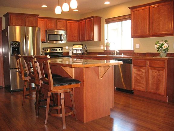 Great size island with granite tile counter. Spacious kitchen with stainless steel appliances