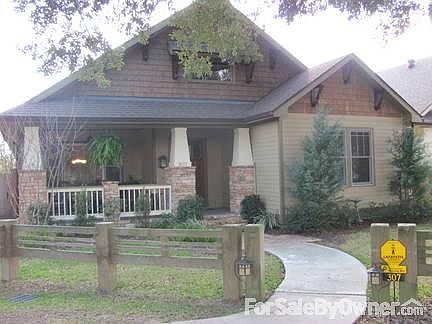 Front of home
						:
						House sits on park with seven large oak trees.