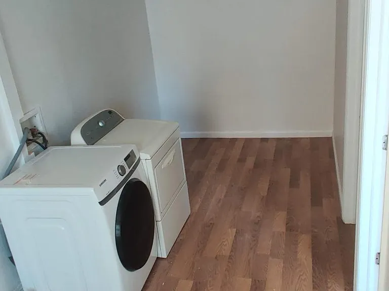 hallway for washer/dryer, behind the kitchen and access for 3rd and 4th bedroom.