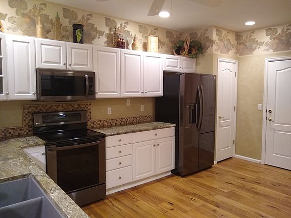 Walk into the kitchen from the garage. Pantry and refrigerator are right there to make putting groceries away very easy,