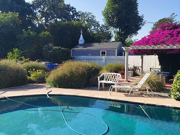 Huge pool with firepit and seating for 4. under fabulous Bougainvillea roof.