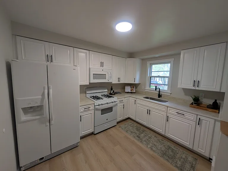 Updated Kitchen
Quartz countertops
Undermount sink
Pull down faucet
Complete with Fridge, Stove & Microwave