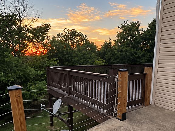 Gate entrance off driveway to lower deck.