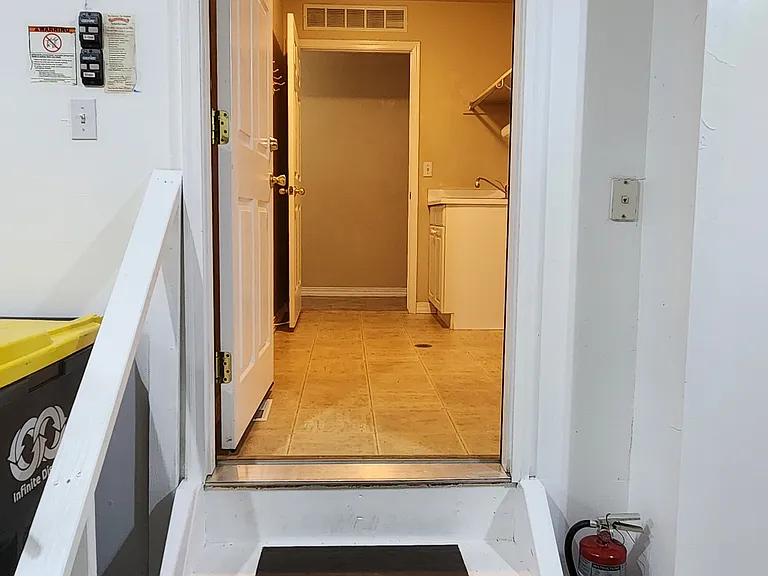 From Garage, looking into Laundry / Mud Room. Door on the far side opens to hallway